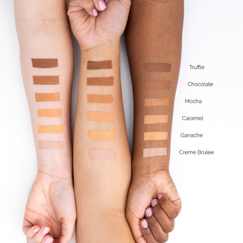 An image of three outstretched arms of differing skin tones showcasing different colors of Finesse concealer in swatches on each arm for comparison.